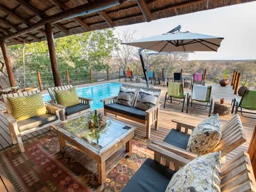 Outside deck with seating area and outside pool